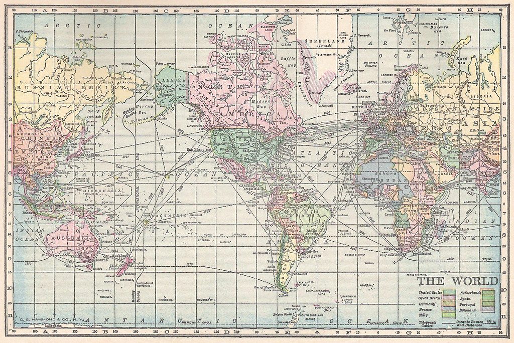 A hand-coloured 1911 map of the world showing continents and shipping routes.
