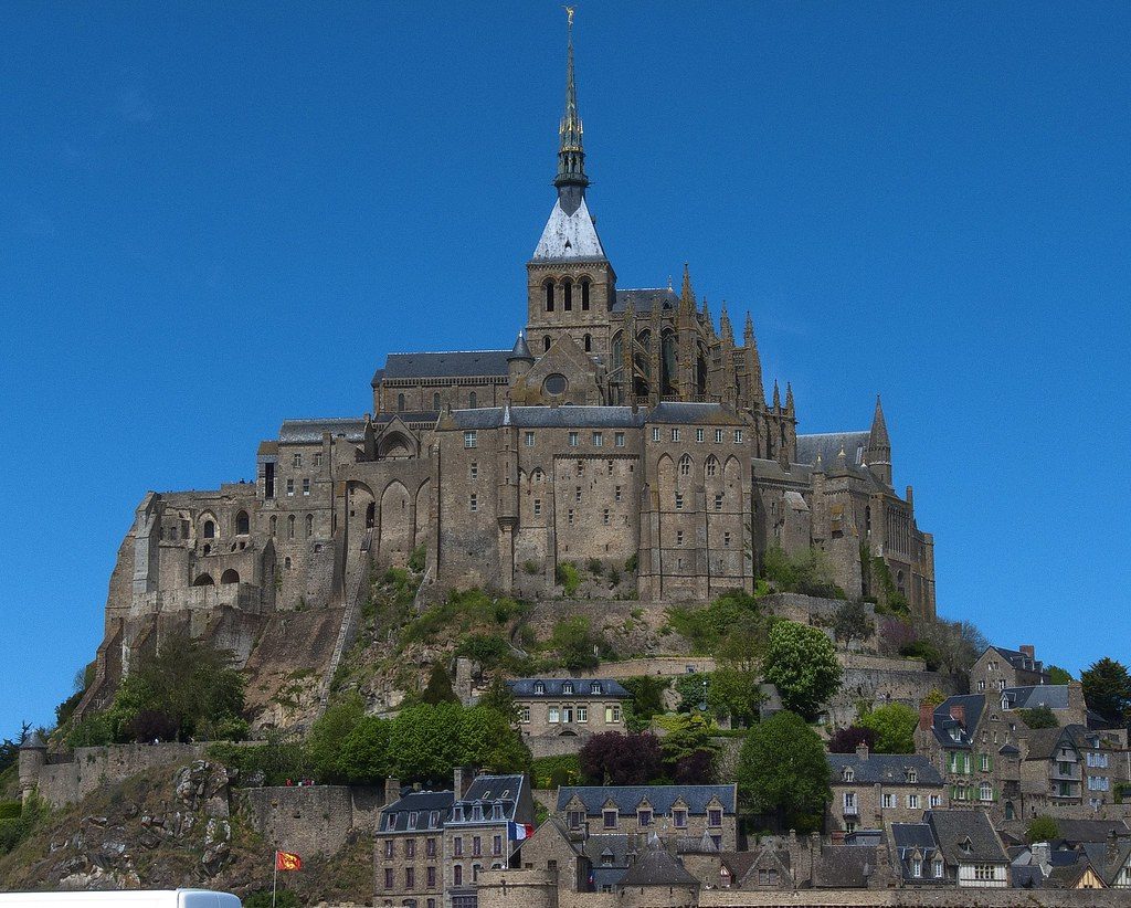 The abbey of Mont Saint-Michel rising above the tidal flats in Normandy, France.