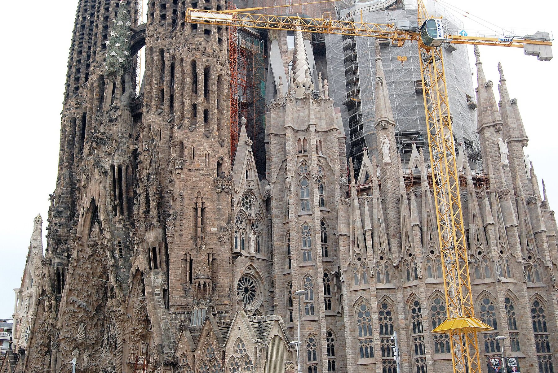 The carved stone facade and spires of the Sagrada Familia in Barcelona.